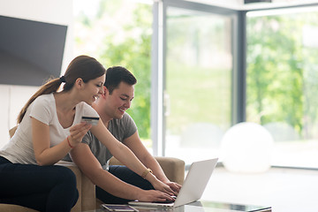 Image showing happy young couple buying online