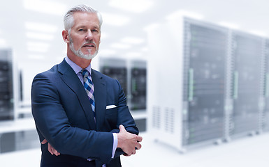 Image showing Senior businessman in server room