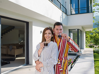 Image showing Young beautiful couple in bathrobes