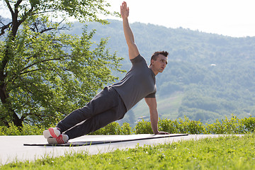 Image showing man doing morning yoga exercises