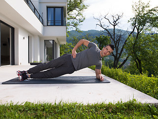 Image showing man doing morning yoga exercises