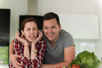 Image showing Young couple in the kitchen