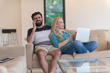 Image showing young happy couple relaxes in the living room