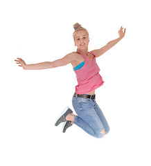 Image showing Pretty woman jumping into the air