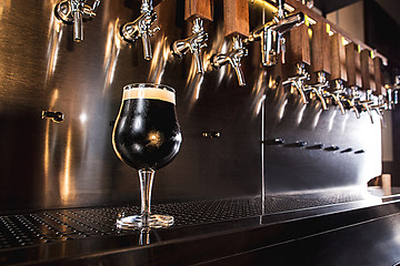 Image showing Beer taps in a pub