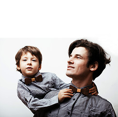 Image showing father with son in bowties on white background, casual look