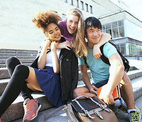 Image showing cute group teenages at the building of university with books huggings, back to school