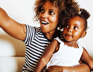 Image showing adorable sweet young afro-american mother with cute little daugh