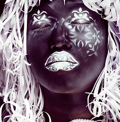 Image showing creative makeup like Ethiopian mask, white pattern on black face