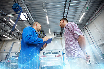 Image showing auto mechanic with clipboard and man at car shop