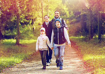 Image showing happy family with backpacks hiking