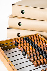 Image showing Old abacus and folders with documents, close-up 