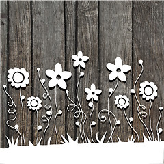 Image showing paper  cut flowers on wooden background
