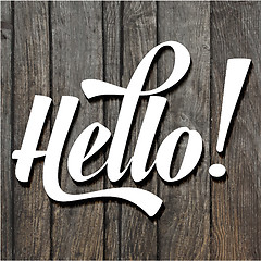 Image showing paper cut word HELLO on wooden background