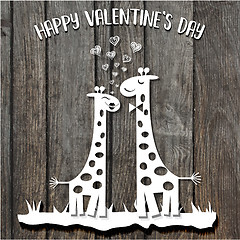 Image showing paper cut giraffes in love, Valentine\'s Day card on wooden backg