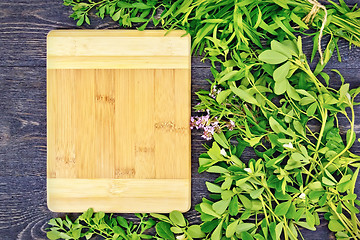 Image showing Frame of spicy grass and rectangular board