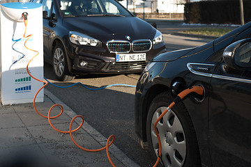 Image showing BMW i and Opel Ampera electric cars being charged