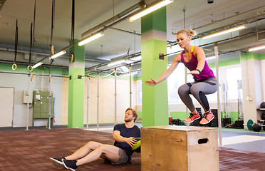 Image showing woman and man with medicine ball exercising in gym