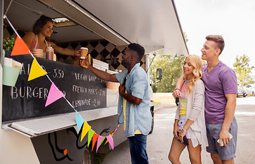 Image showing happy customers queue at food truck