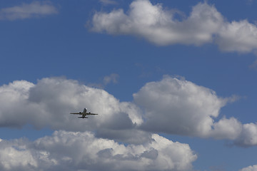 Image showing Airplane flies against a background of white cloud