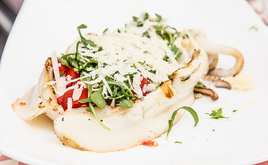 Image showing Cuttlefish with tomato, salad and Parmigiano cheese