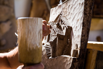 Image showing Sculptor hands working wood