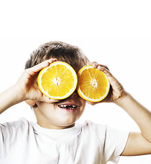 Image showing little cute boy with orange fruit double isolated on white smili