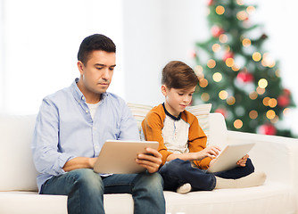 Image showing father and son with tablet pc at christmas