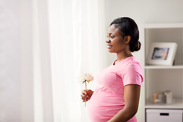 Image showing happy african american pregnant woman with flower