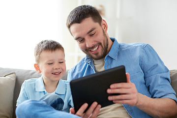 Image showing father and son with tablet pc playing at home