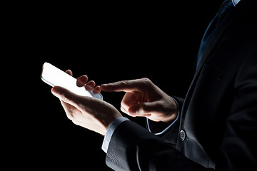 Image showing close up of businessman with glass smartphone