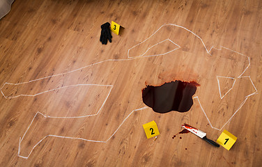 Image showing chalk outline and knife in blood at crime scene