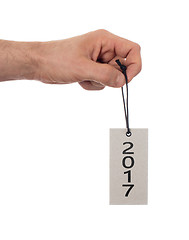 Image showing Hand holding a tag - New year - 2017