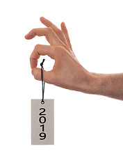 Image showing Hand holding a tag - New year - 2019
