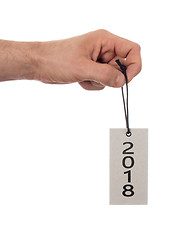 Image showing Hand holding a tag - New year - 2018