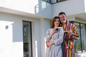 Image showing Young beautiful couple in bathrobes