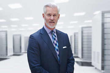 Image showing Senior businessman in server room