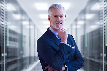 Image showing Senior businessman in server room