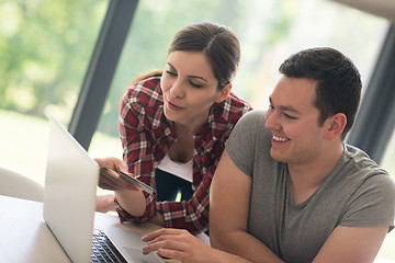 Image showing happy young couple buying online