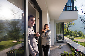 Image showing couple enjoying on the door of their luxury home villa