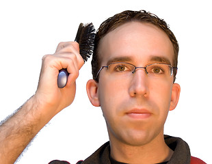 Image showing Man Brushing His Hair