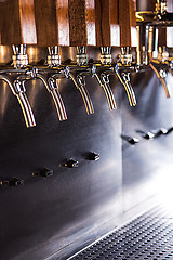 Image showing Beer taps in a pub