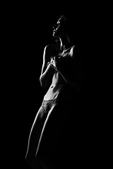 Image showing Black and white silhouette of young, sporty and sexy woman in lingerie