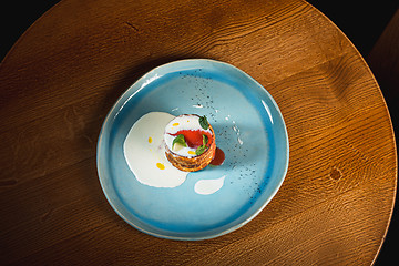 Image showing plate with tasty pancakes on wooden table