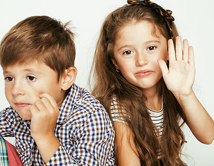 Image showing little cute boy and girl hugging playing on white background, happy family smiling twins