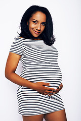 Image showing young pretty african american woman pregnant happy smiling, posing on white background isolated , lifestyle people concept copyspace 