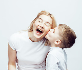 Image showing young modern blond curly mother with cute son together happy smiling family posing cheerful on white background, lifestyle people concept, sister and brother friends