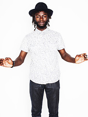 Image showing young handsome afro american boy in stylish hipster hat gesturin