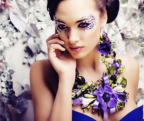 Image showing floral face art with anemone in jewelry, sensual young brunette 