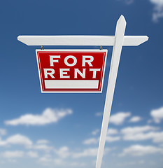 Image showing Left Facing For Rent Real Estate Sign on a Blue Sky with Clouds.